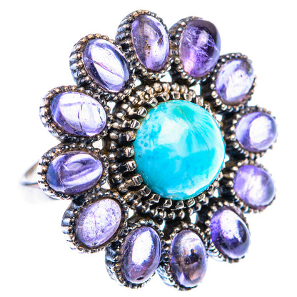 Sterling silver ring with large oval blue gemstone center and purple oval halo, beaded