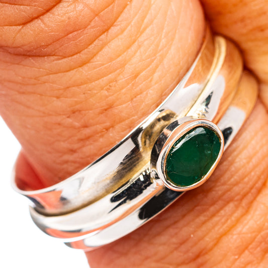 Sterling silver ring with oval green emerald bezel setting