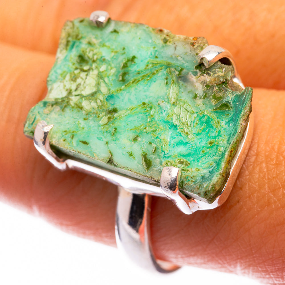 Large chrysoprase ring on finger: green cushionlike stone set in 925 silver