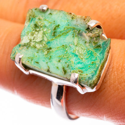 Large chrysoprase ring on finger: green cushionlike stone set in 925 silver