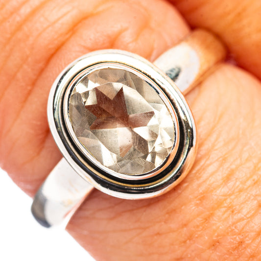 Sterling silver ring with oval faceted gemstone bezel setting