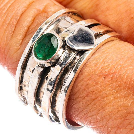 Sterling silver ring with oval green emerald-style gemstone, polished bezel and wide band