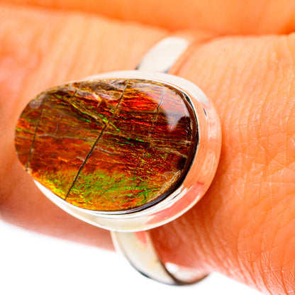 Oval ammolite gemstone ring in 925 sterling silver, close-up on iridescent stone