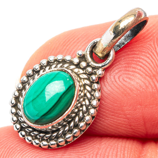 Oval malachite-green stone pendant with textured silver beaded frame and loop bail