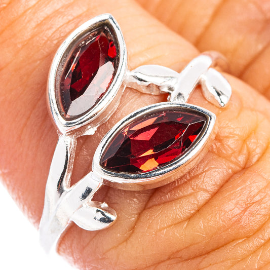 Sterling silver leaf ring with two oval garnet-red gemstones, dainty design