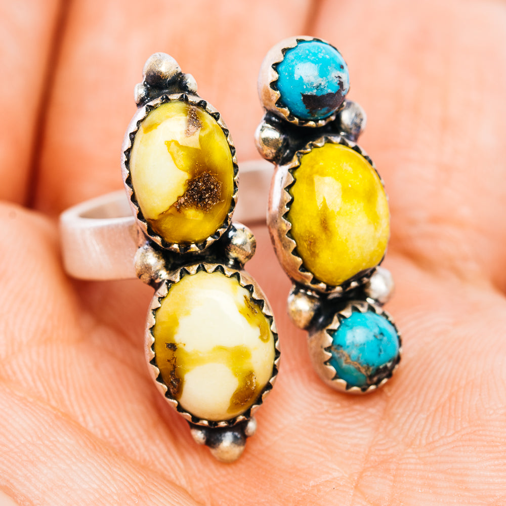 Adjustable sterling silver ring with two oval yellow stones and two blue round stones