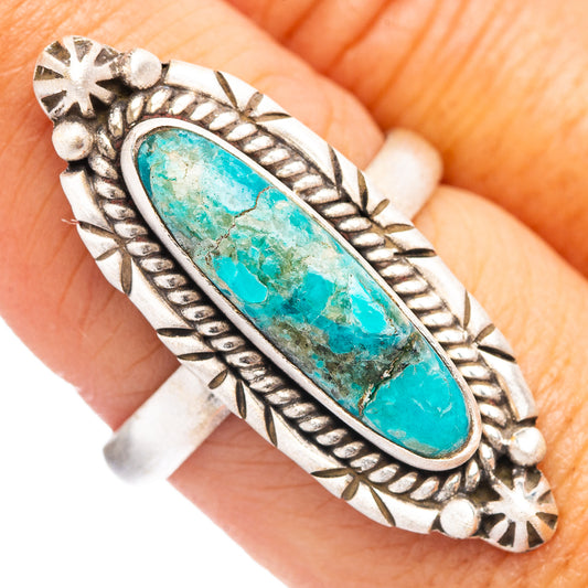 Sterling silver ring with oval turquoise cabochon, braided border and star details