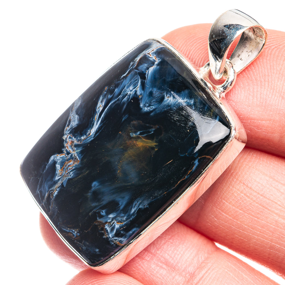 Sterling silver bail with rectangular pietersite pendant, blue and gold veining on stone