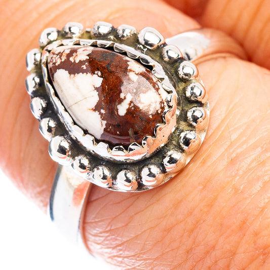 Sterling silver oval jasper ring with beaded rim and prong setting, marbled red and cream