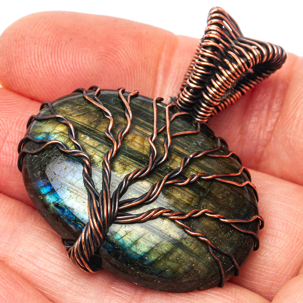 Labradorite tree of life pendant with oxidized copper wire wrapping, close-up view