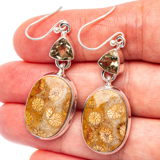 Sterling silver drop earrings: oval fossil-like amber cabochon with yellow top stone