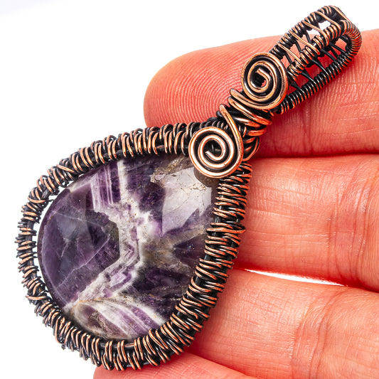 Oxidized copper wire-wrap amethyst teardrop pendant with spiral bezel detail