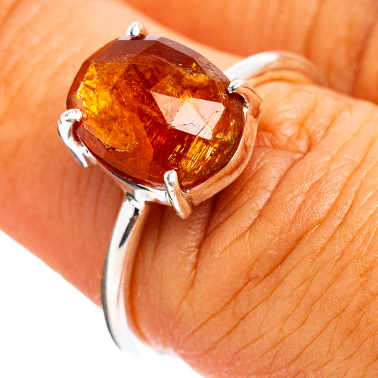 Orange kyanite sterling silver ring with oval gemstone in four-prong setting