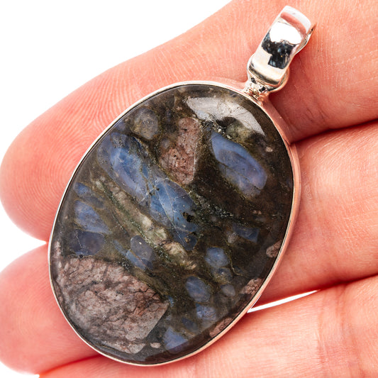 Oval blue opal pendant set in .925 sterling silver, round bezel with bail