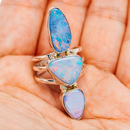 Sterling silver opal ring with three blue tri-color stones, bezel-set stack design