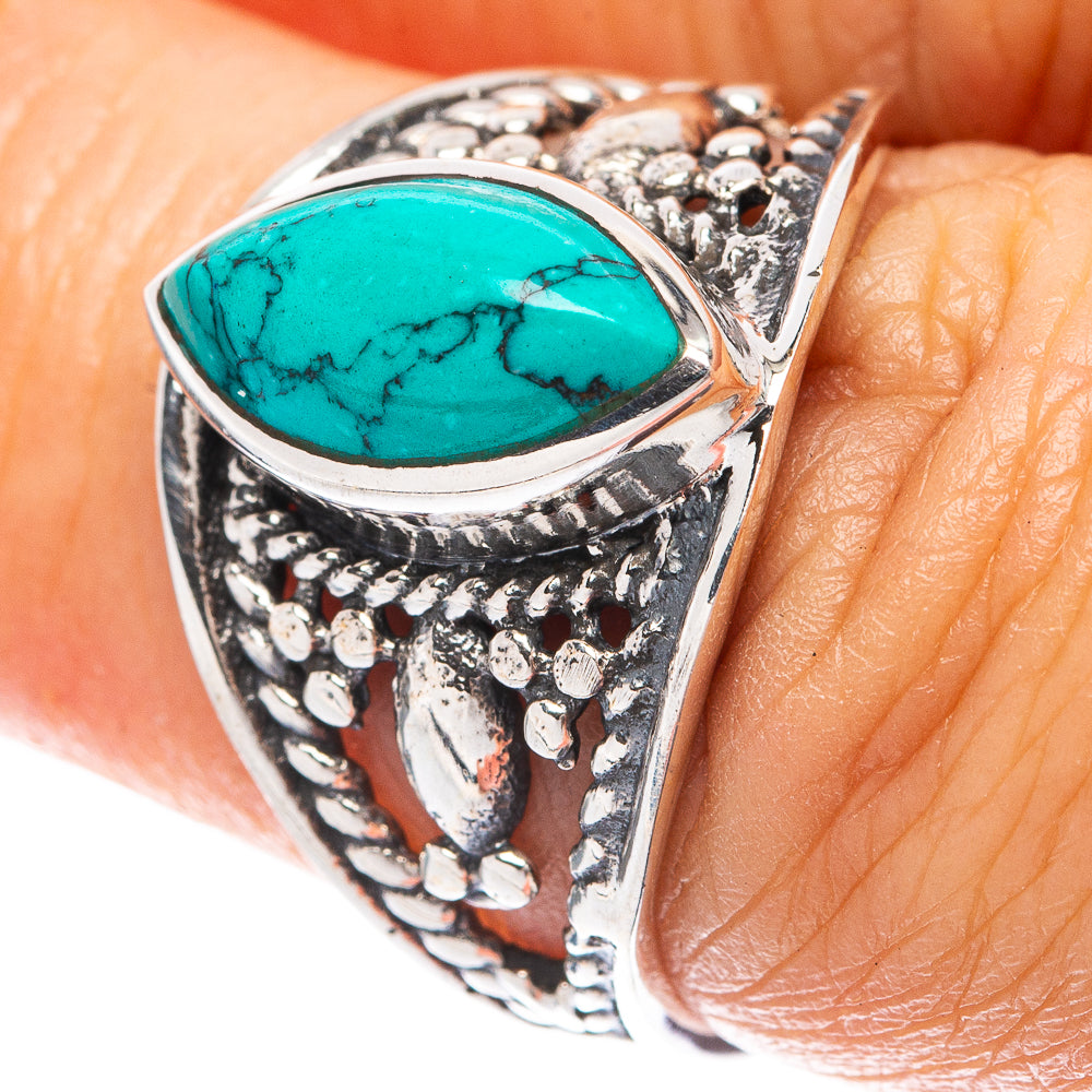 Sterling silver turquoise cabochon ring with filigree style cutout details