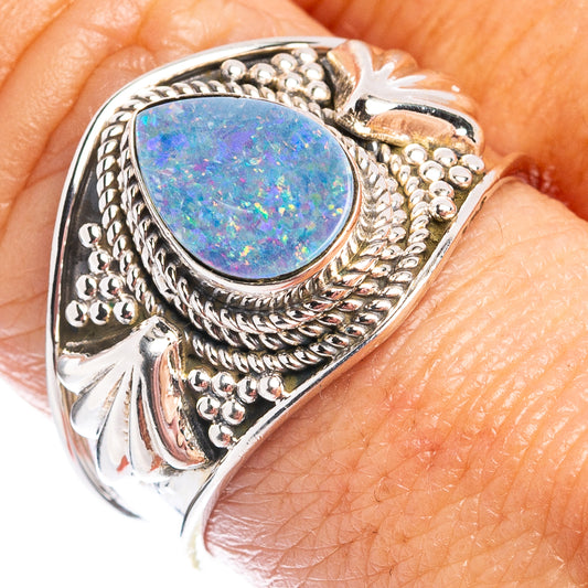 Sterling silver ring with oval opal cabochon and ornate beaded double-banding