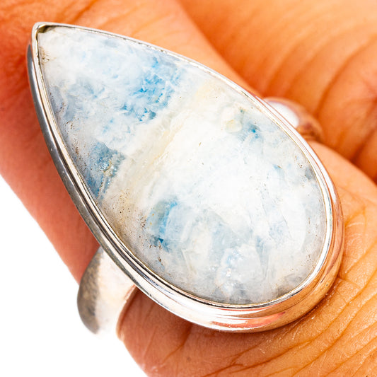 Sterling silver ring with oval blue scheelite stone, open setting