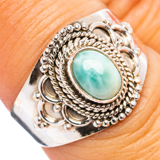 Sterling silver ring with oval green Larimar cabochon and ornate braided setting