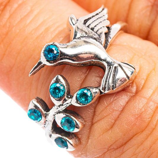 Sterling silver hummingbird ring with blue zirconia and branch-like setting