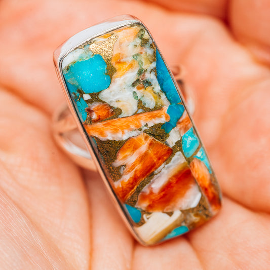 Turquoise stone in rectangular bezel with orange spiny oyster segments on sterling silver ring