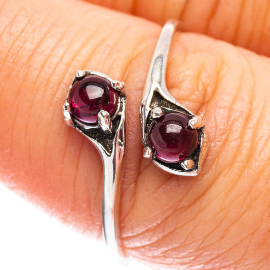 Sterling silver ring with two dark red garnet cabochon stones on split band