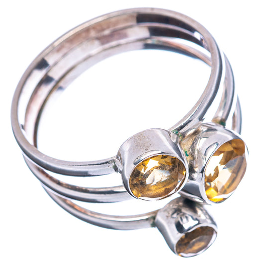Sterling silver citrine ring with three round stones and open band, side view