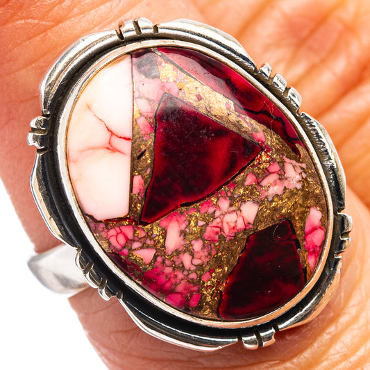 Sterling silver oval ring with red, pink, and gold glittery turquoise-style stone
