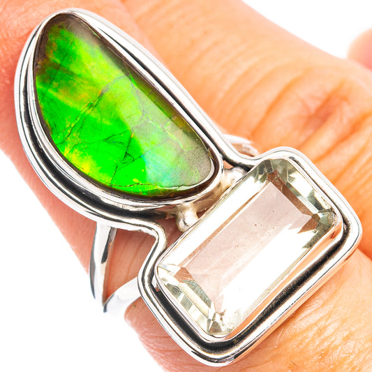 Sterling silver ring with green iridescent teardrop gemstone and clear rectangular stone