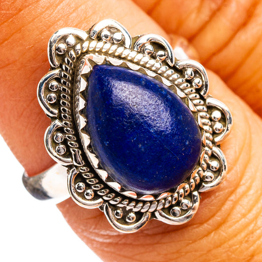 Sterling silver rose quartz cabochon ring, ornate bezel with blue teardrop stone