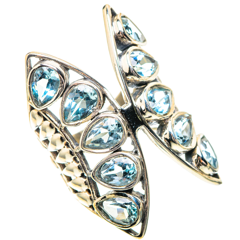 Sterling silver ring with row of oval blue topaz stones and openwork bar