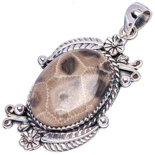 Sterling silver oval pendant with fossil coral cabochon, decorative bail and loops