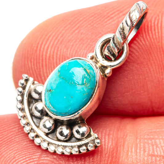 Turquoise cabochon pendant in .925 sterling silver with ornate bead border