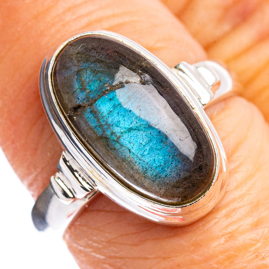 Size 7 labradorite ring in .925 sterling silver, oval bezel-set stone with blue flash.