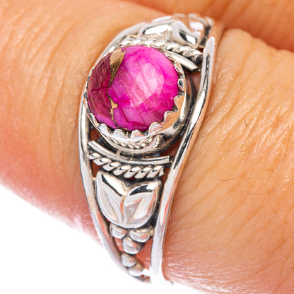 Sterling silver ring with oval magenta-purple gemstone cabochon and ornate leaf setting