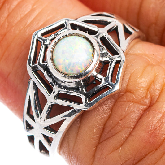 Sterling silver opal ring with openwork web setting and round iridescent cabochon