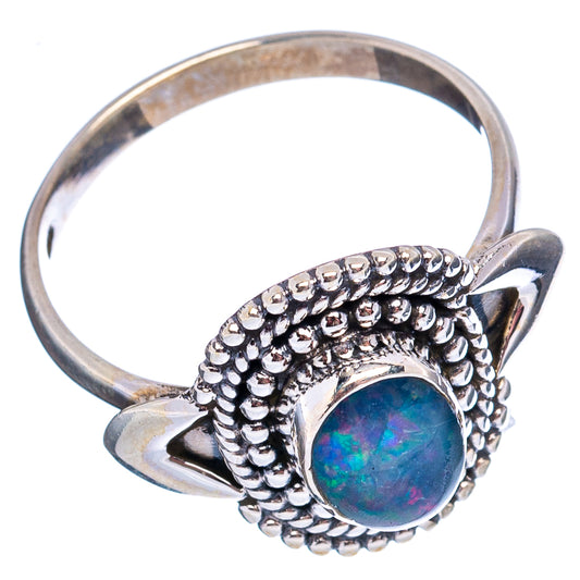 Sterling silver opal ring with oval blue opal center and beaded side halo