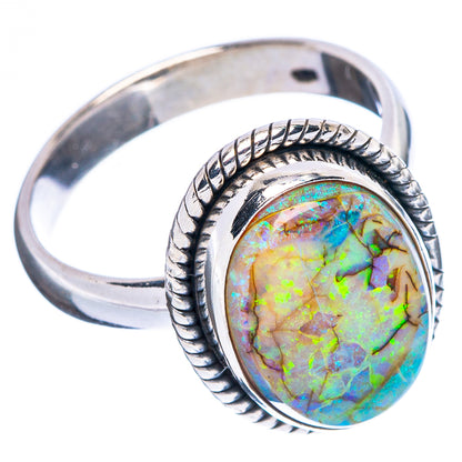 Sterling silver oval opal ring with rope border; rainbow green-blue glow
