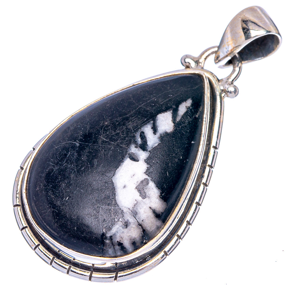 Teardrop pinolith jasper pendant showing black stone with white mineral veining, silver bezel