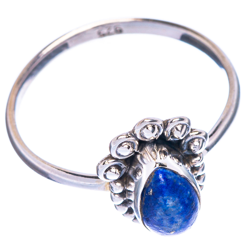 Oval blue lapis cabochon sterling silver ring with ornate petal-style setting