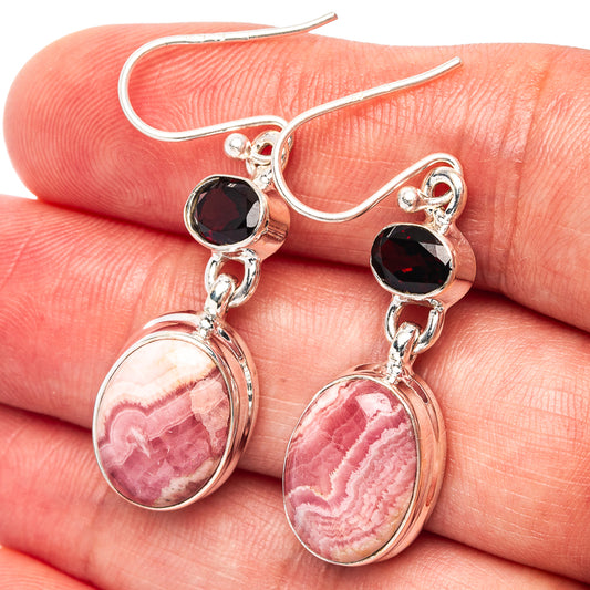 Sterling silver drop earrings with pink rhodochrosite teardrop stones and dark garnet accents