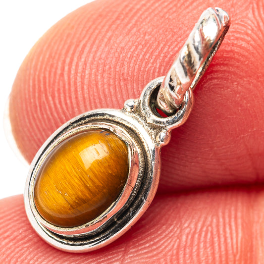 Sterling silver tiger's eye pendant with oval amber cabochon and loop bail