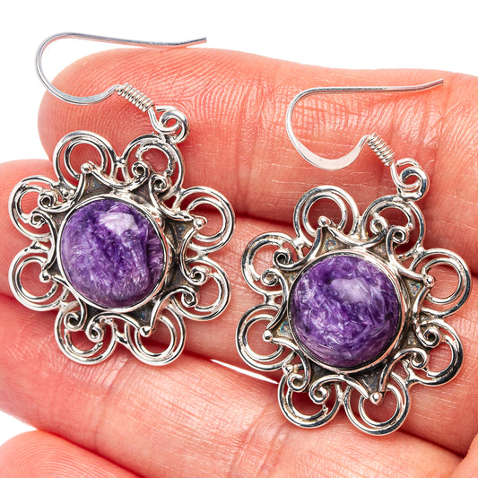 Sterling silver drop earrings with round purple charoite and filigree swirl setting