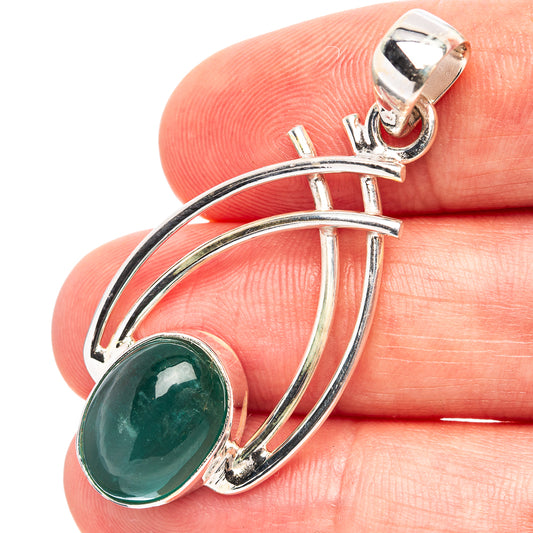 Sterling silver pendant with oval green emerald and curved multi-rail frame