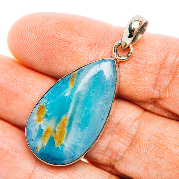 Teardrop opal pendant with blue stone and gold accents, German silver setting and loop