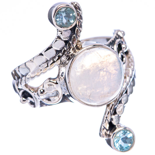 Ornate sterling silver moonstone ring with round blue topaz accents around the band