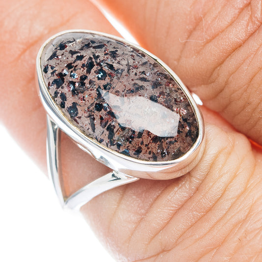 Sterling silver oval ring with dark speckled lepidocrocite gemstone, polished band