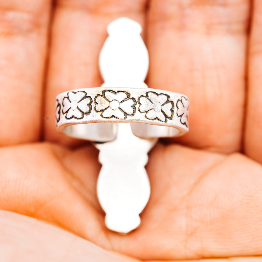 Sterling silver adjustable ring with floral engraved band detail on open back