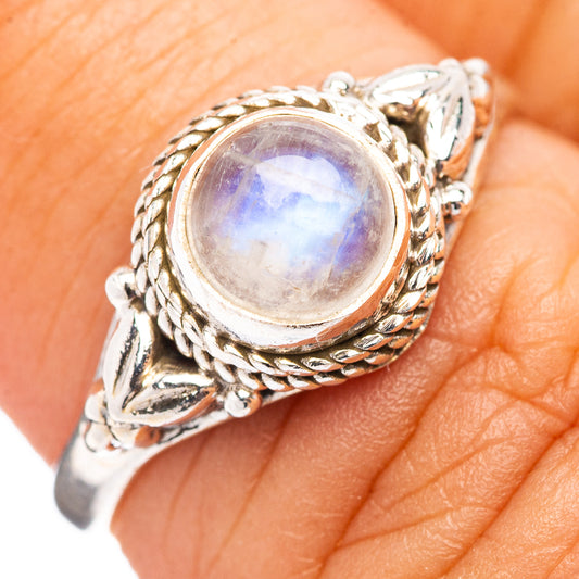Sterling silver moonstone ring with oval rainbow-lustre stone and braided filigree setting