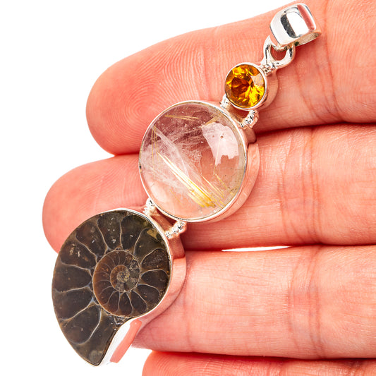 Three-stone sterling silver pendant with dark ammonite fossil, clear quartz, and orange citrine